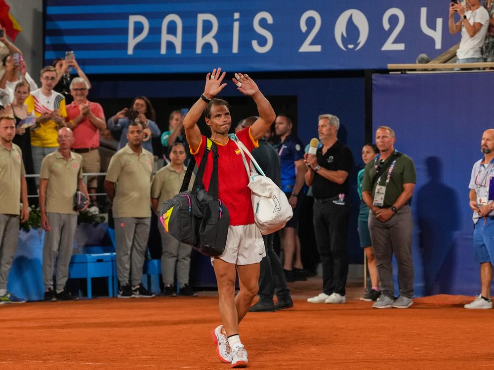 Spain's Rafael Nadal greets fans after losing his match with Carlos Alcaraz against the United States' Austin Krajicek and Rajeev Ram during the men's doubles quarter-final tennis match Wednesday.