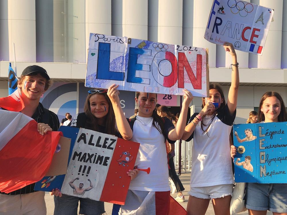Young fans gathered outside La Defense arena in a Paris suburb Friday to cheer on their new swimming hero, Léon Marchand. He came through for them, winning a fourth gold medal.