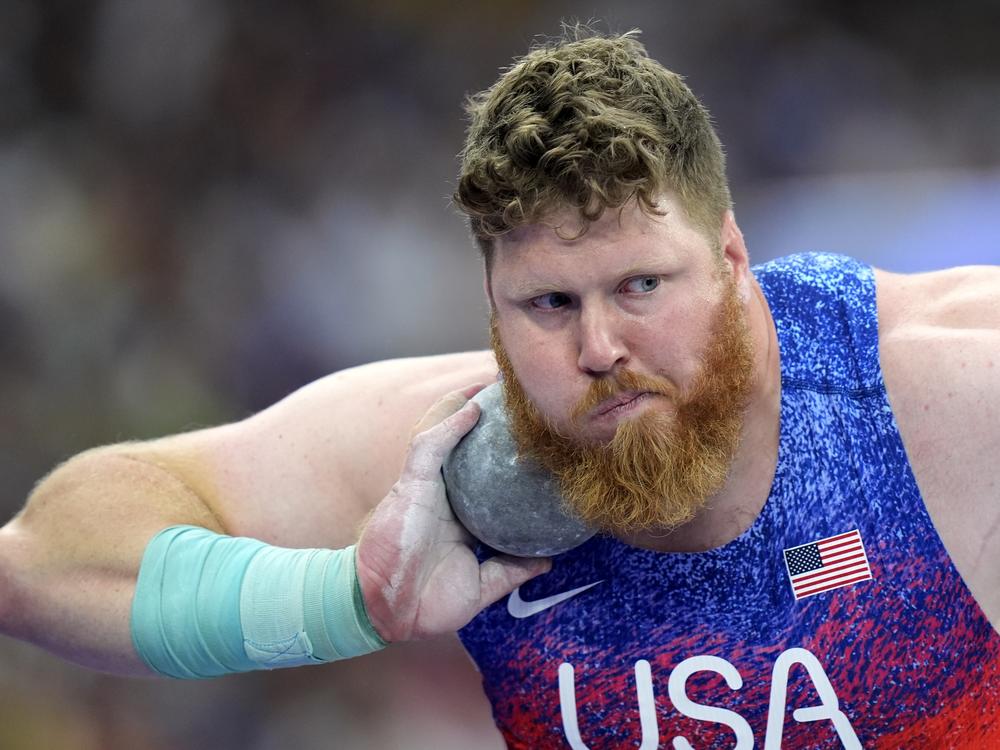 Ryan Crouser, of the United States, competes in the men's shot put final at the Paris Olympics. He won his third gold in a row on Saturday.