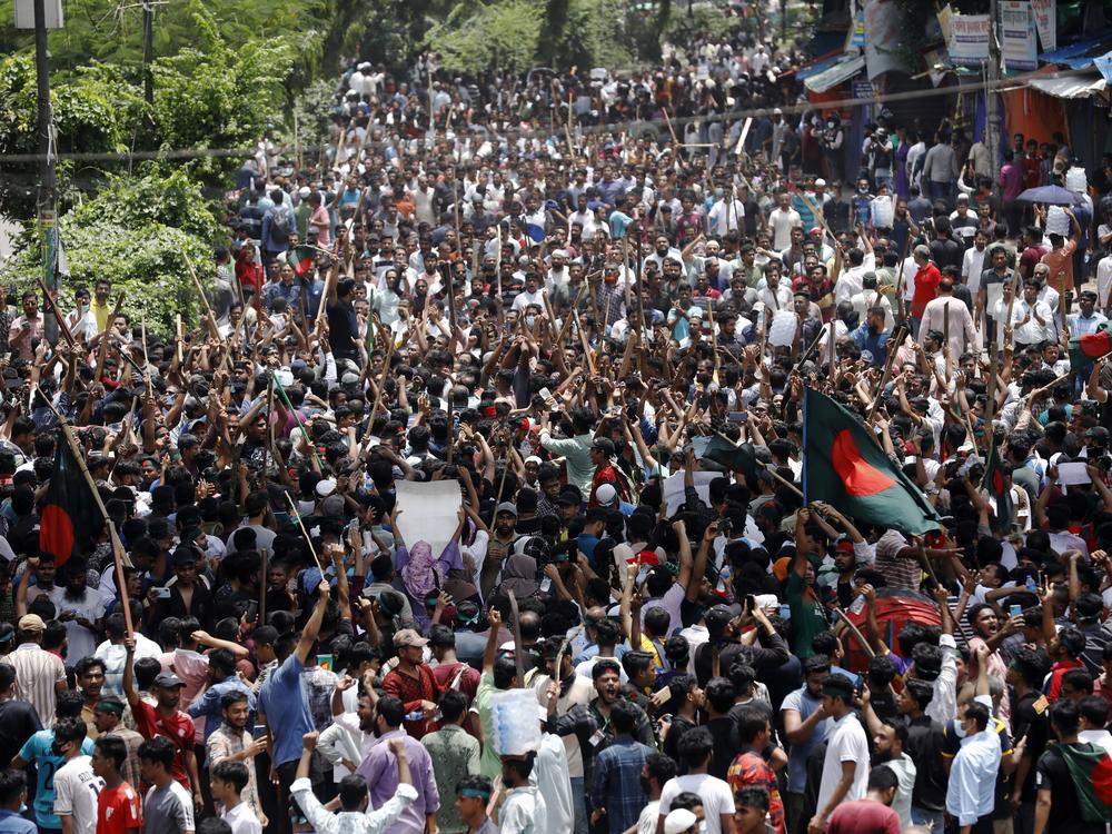 People participate in a rally against Prime Minister Sheikh Hasina and her government in Dhaka, Bangladesh on Sunday. 