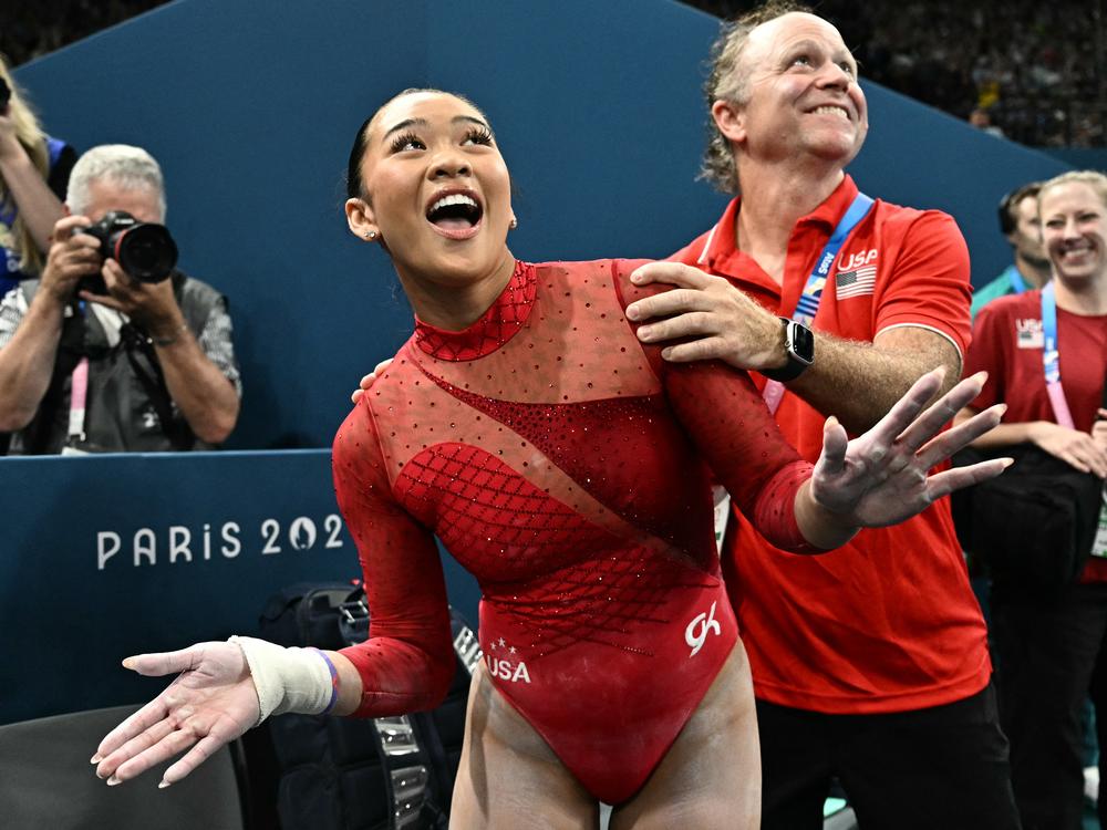 The USA's Sunisa Lee celebrates winning the bronze medal at the end of the women's uneven bars final Sunday. It was her third medal of the Games and sixth Olympic medal overall.