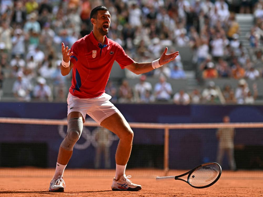 Serbia's Novak Djokovic reacts to beating Spain's Carlos Alcaraz to win gold after their men's singles final tennis match at the Roland-Garros Stadium Sunday during the Paris Olympics. It was Djokovic's first-ever gold medal.