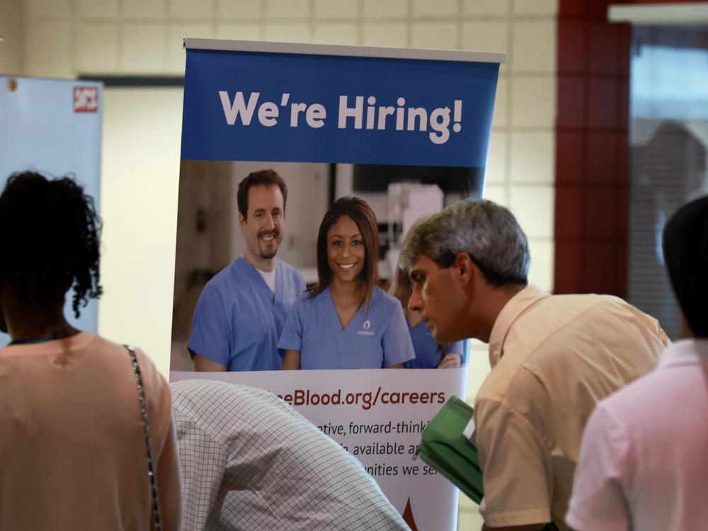 Job seekers attend a job fair in Sunrise, Fl., on June 26, 2024. Employers added only 114,000 jobs last month, well below expectations, raising fears about the economy.