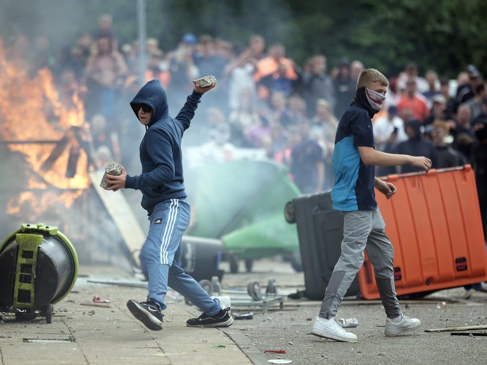Rioters threw bricks, glass bottles and wooden planks at police officers as well as sprayed them with fire extinguishers during the riot in Rotherham, according to local police.