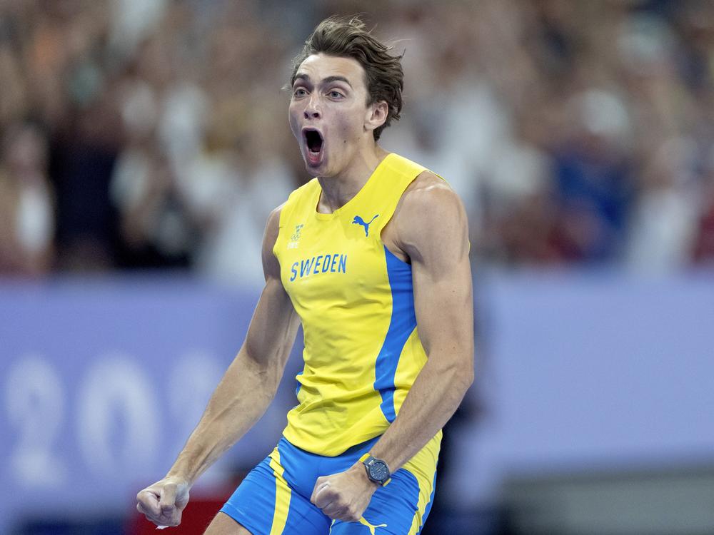 Armand Duplantis, of Sweden, reacts after setting a new world record in the men's pole vault final at the Paris Olympics on Monday in Saint-Denis, France.