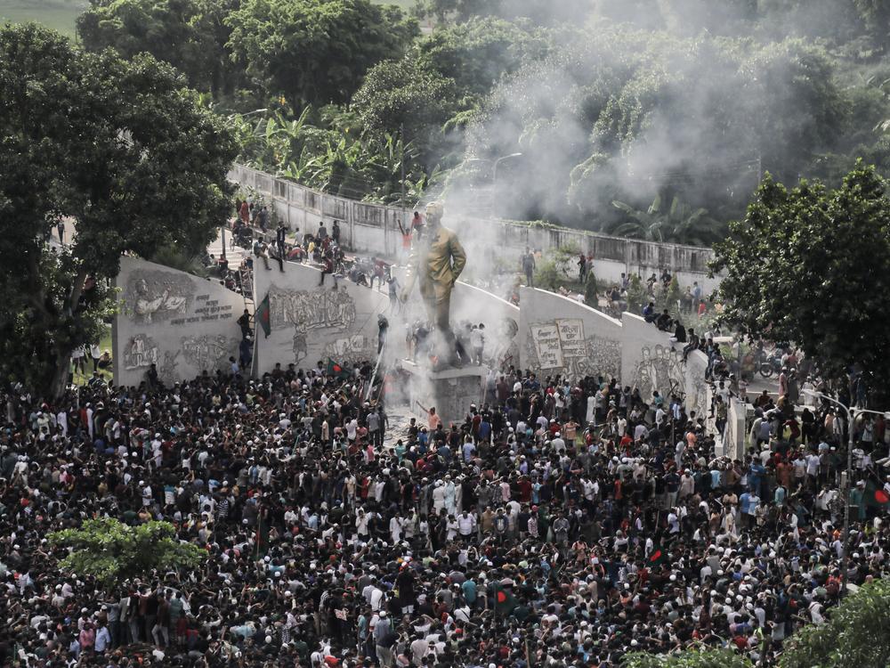 People gather to celebrate the fall of Bangladesh Prime Minister Sheikh Hasina after an intense clash between police, pro-government forces, and anti-Quota protesters in Dhaka, Bangladesh, on August 5.
