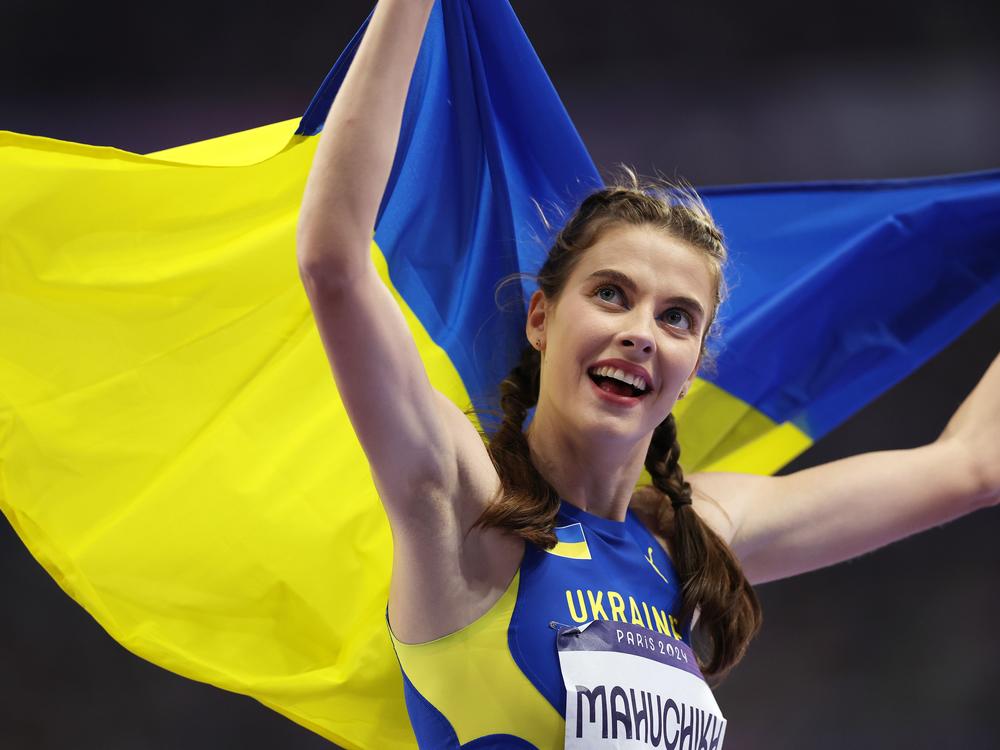 Gold medalist Yaroslava Mahuchikh celebrates her win in the women's high jump final at the Paris Olympic Games, on a day when Ukraine won three medals. Ukrainian athletes are dedicating their victories to the Ukrainian people who face a grinding invasion by Russia.