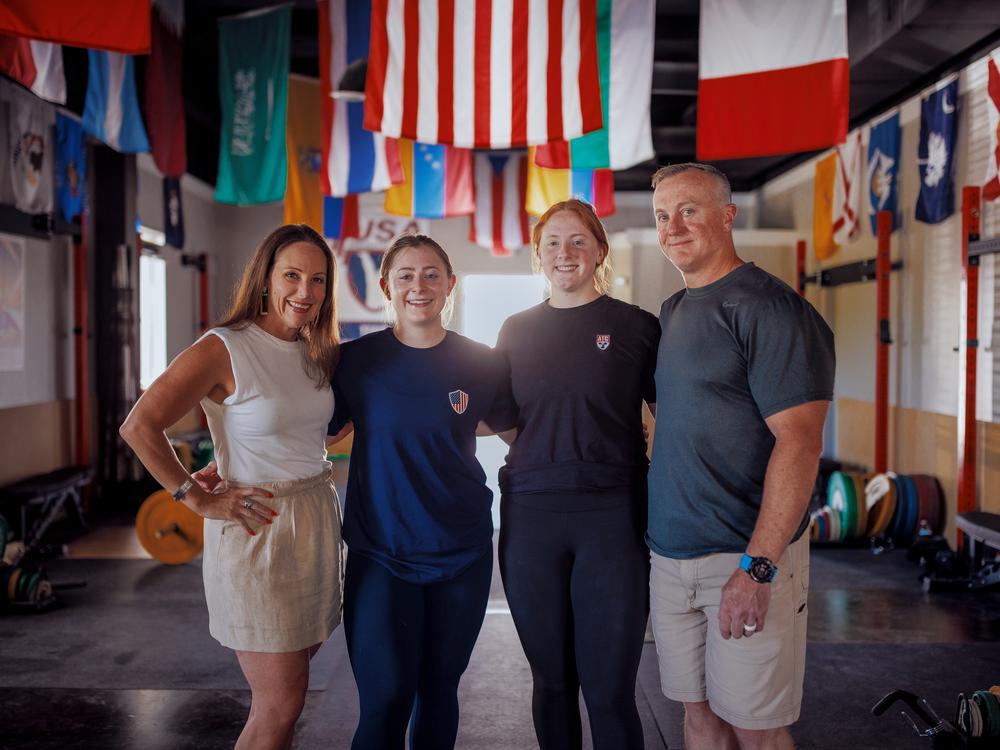 Olivia Reeves, second from left, is supported by her sister, Haley, and her parents, Amber and Jason.
