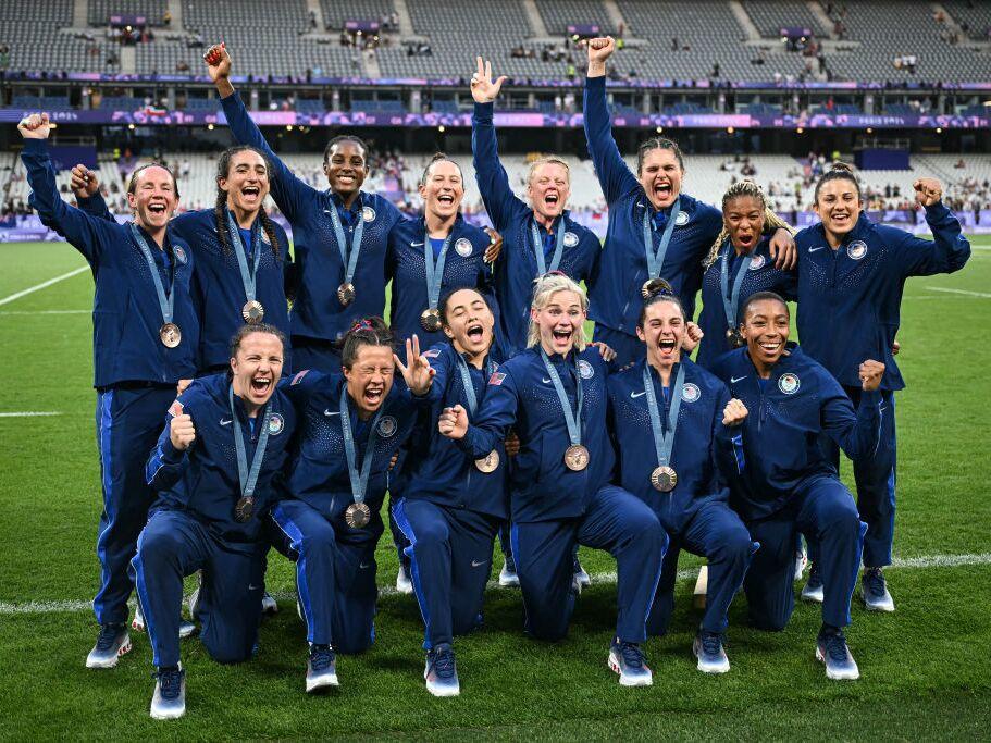 Team USA celebrates with their bronze medals during the victory ceremony during the Paris 2024 Olympic Games at the Stade de France in Saint-Denis on Tuesday. 