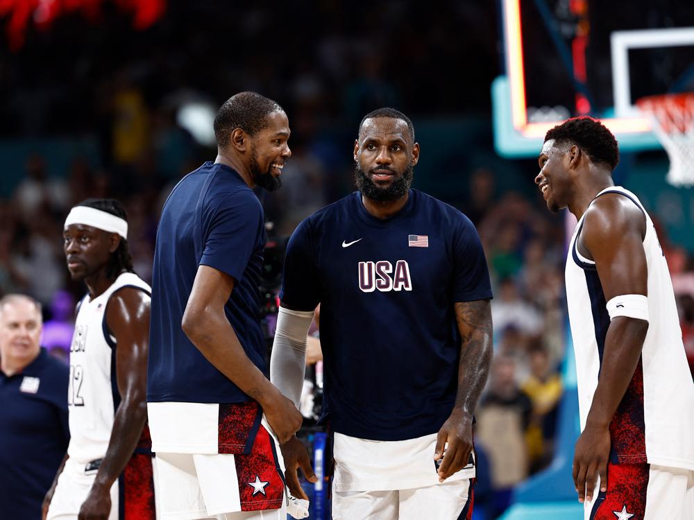 From left, USA's Kevin Durant, LeBron James and Anthony Edwards are seen after winning a group game against South Sudan during the Paris Olympic Games in Villeneuve-d'Ascq, northern France, on July 31.