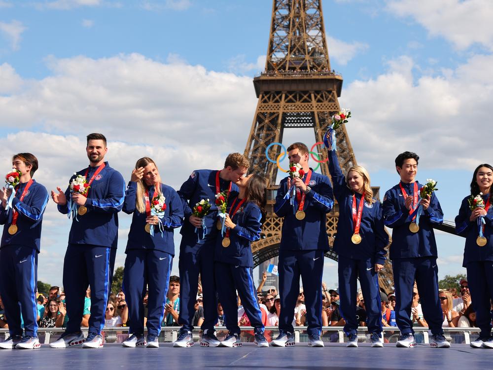 Two years after they won, members of the U.S. figure skating team celebrate their victory and receive their gold medals won during the 2022 Beijing Winter Olympics. The delayed ceremony, held during the Paris Summer Games, follows the recent disqualification of Russia following a doping controversy.