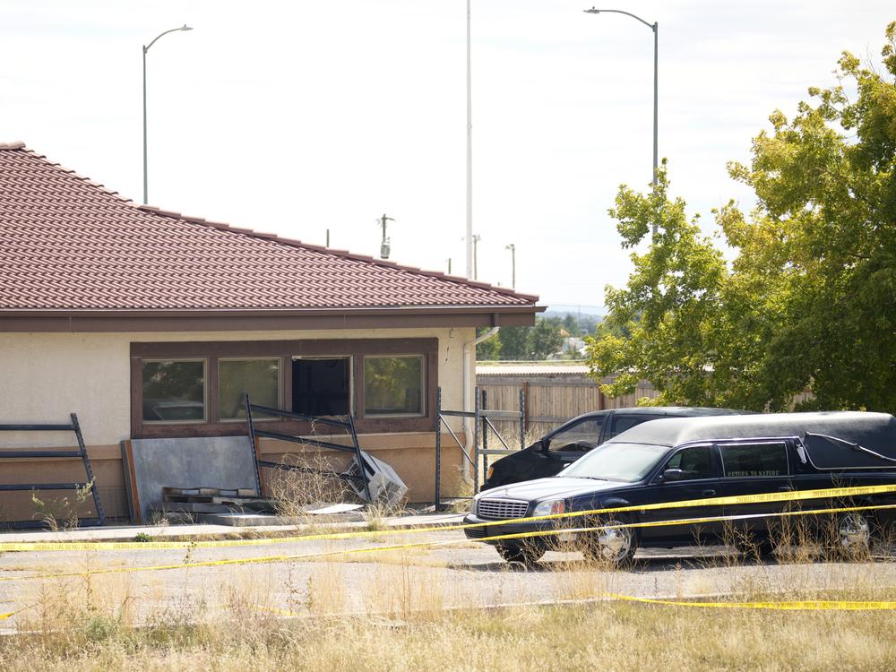 A hearse and van sit outside the Return to Nature Funeral Home in Penrose, Colo., on Oct. 6, 2023. On Monday, a judge ordered the funeral home’s owners, Carie and Jon Hallford, to pay $950 million to families whose loved ones' remains were mishandled.