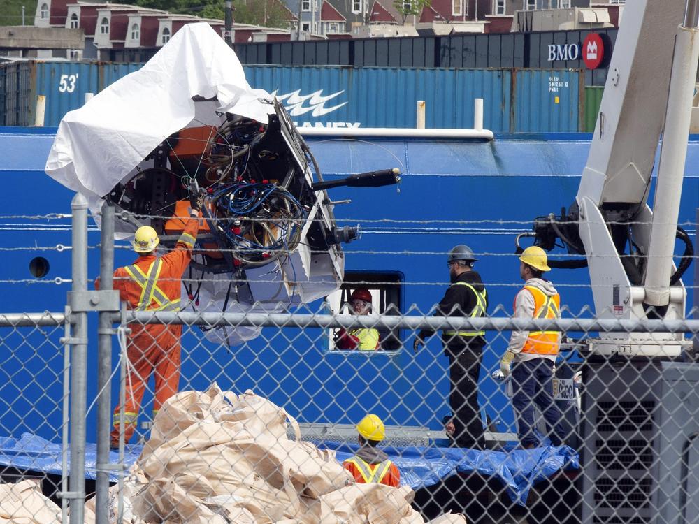 Debris from the Titan submersible, recovered from the ocean floor, is unloaded from the ship Horizon Arctic at the Canadian Coast Guard pier in St. John's, Newfoundland, on June 28, 2023.
