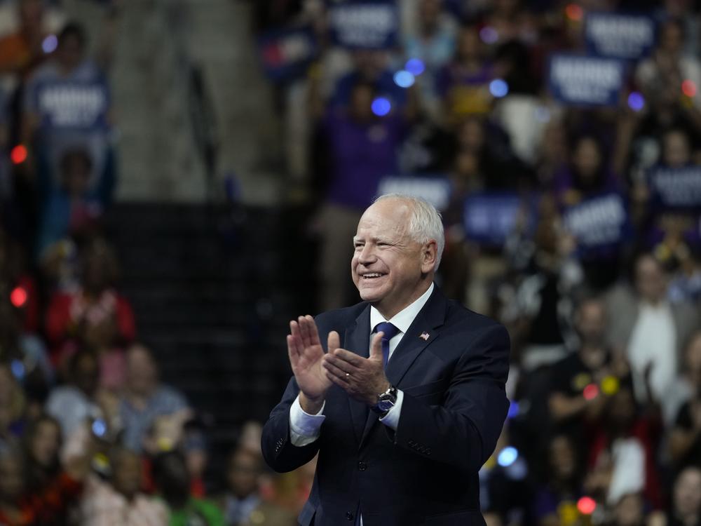 Minnesota Gov. Tim Walz, pictured at a campaign rally in Philadelphia on Tuesday, is getting attention for a law he signed last year requiring public schools to provide free period products.