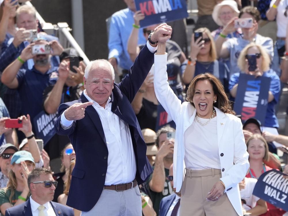 Democratic presidential nominee Vice President Kamala Harris is welcomed by Democratic vice presidential nominee Minnesota Gov. Tim Walz, before she delivers remarks at a campaign event, Wednesday, Aug. 7, 2024, in Eau Claire, Wisc.