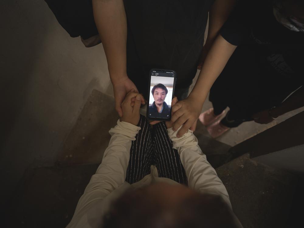 Marooned in Thailand, Gao's family video-calls him thousands of miles away in the Netherlands.