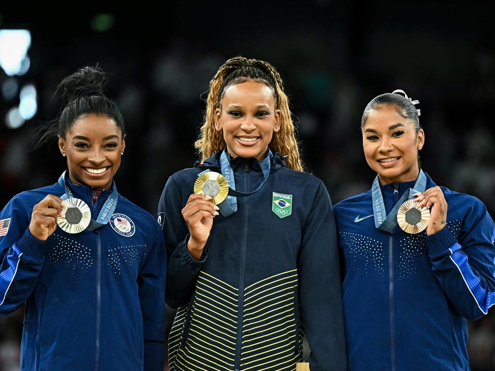 Team USA's Simone Biles (silver) and Jordan Chiles (bronze) book-end Brazil's Rebeca Andrade (gold) as they pose during the podium ceremony for the floor exercise event of the Paris 2024 Olympic Games at the Bercy Arena in Paris, on Monday.