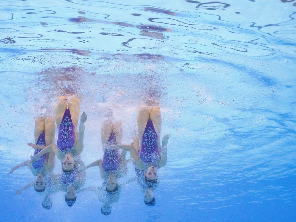 An underwater view shows the Chinese competing in the team free routine of the artistic swimming event during the Paris Olympics at the Aquatics Center in Saint-Denis, north of Paris, on Tuesday.