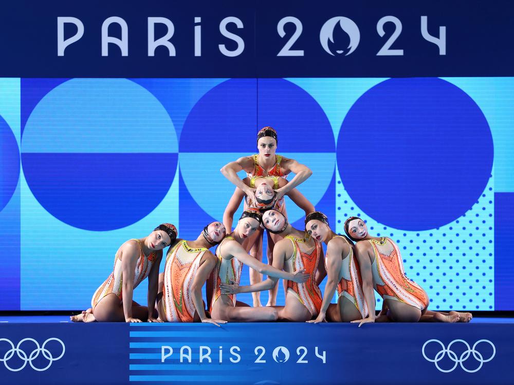 Members of Team France compete in the team free routine at the Olympics Aquatics Center on Tuesday in Paris.
