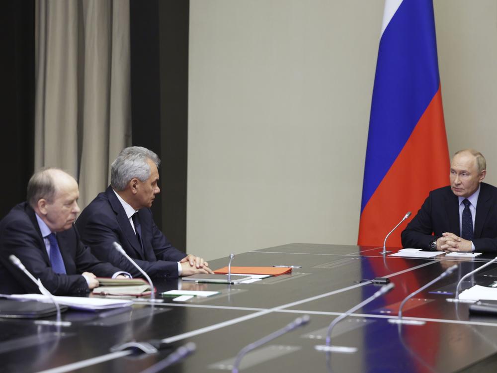 Russian President Vladimir Putin, right, chairs a meeting with top security officials Wednesday to discuss the Ukrainian military incursion in western Russia. 