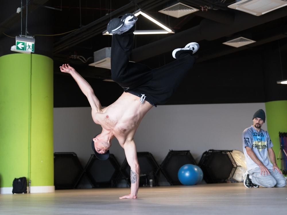Denys Semenikhin, B-boy Gimnast, is the coach of the Ukrainian Olympic breaking team. He started breaking in 2001 and was born and lives in Zaporizhzhia in southeastern Ukraine. He says the psychological state of athletes is no less important than the physical. The opportunity to represent Ukraine during the war is a great honor but also a challenge for the athletes, he says.