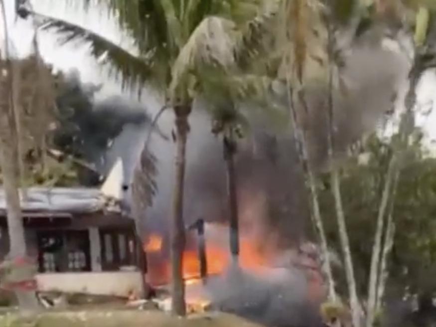 This frame grab from a video shows fire coming from a plane that crashed by a home in Vinhedo, Sao Paulo state, Brazil, Friday.