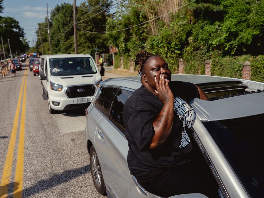 Ebony Williams, 33, of The Ville, yells out “say his name!”, during a unity march commemorating a decade after Michael Brown Jr.’s police killing in Ferguson.