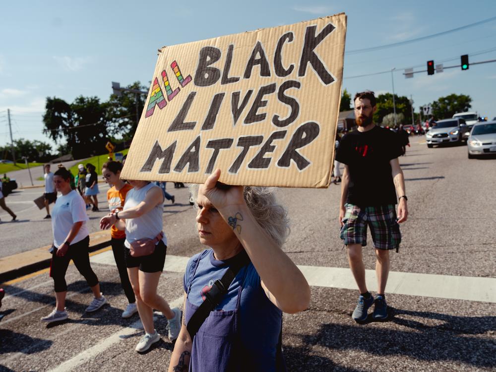 Angelique Kidd, 51, of Ferguson, protests during the unity march.