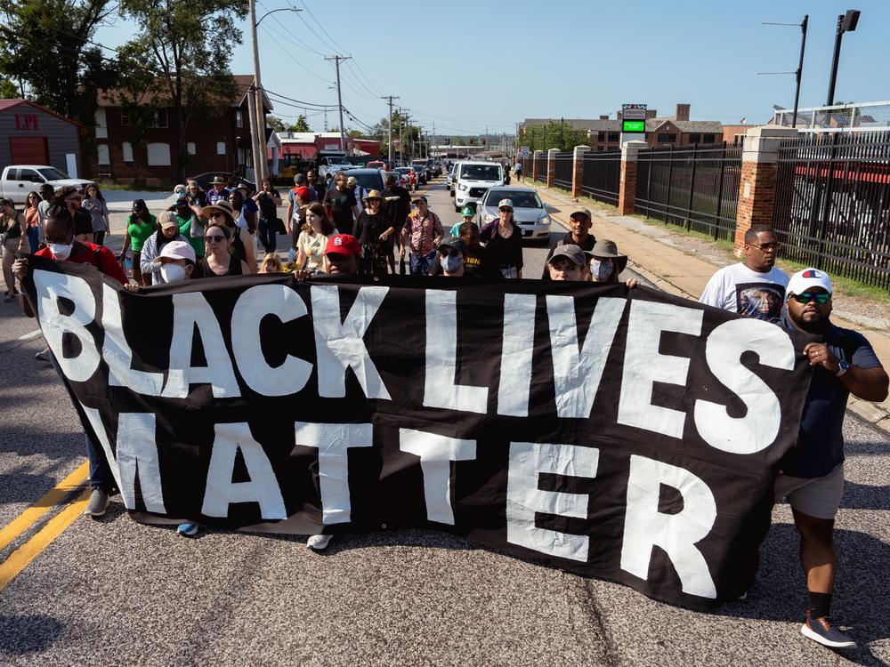 Protestors march streets during a unity march commemorating a decade after Michael Brown Jr.’s police killing.