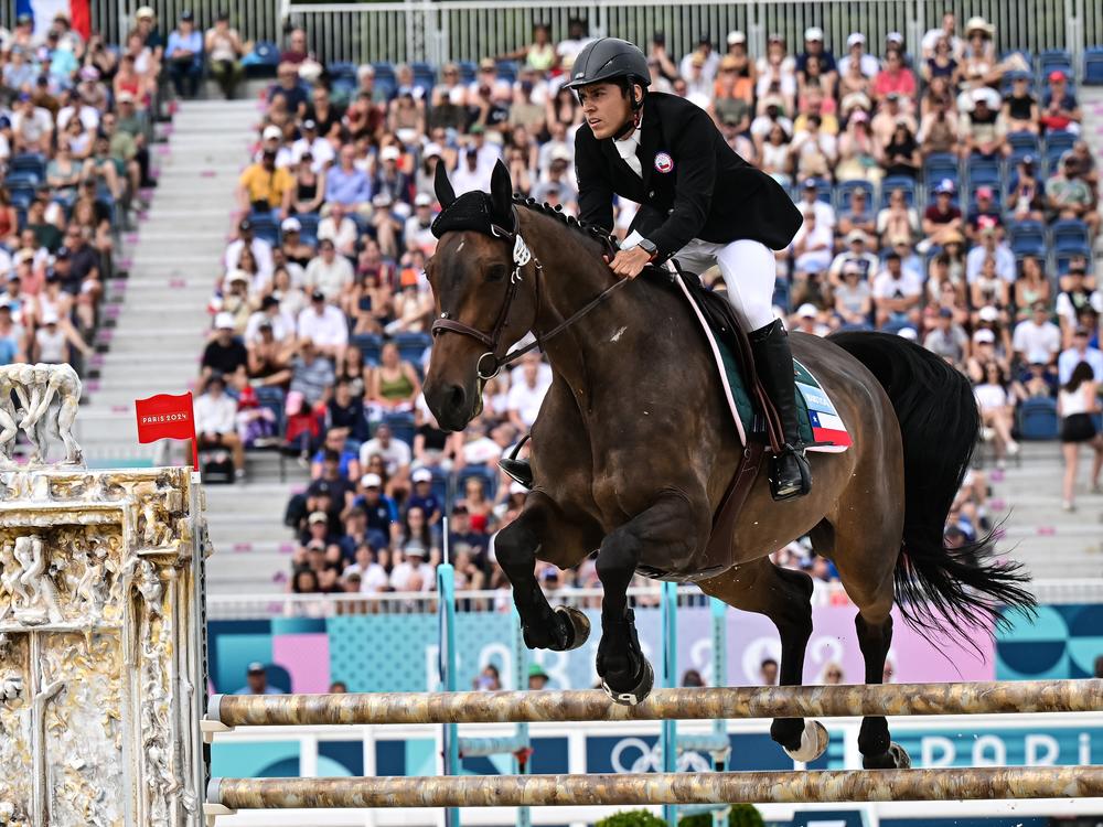 Chile's Esteban Bustos competes in the men's riding show jumping of the modern pentathlon during the Paris 2024 Olympic Games at the Chateau de Versailles in Versailles on Friday. The equestrian portion of the Olympic modern pentathlon will end after these Games — replaced with ... 