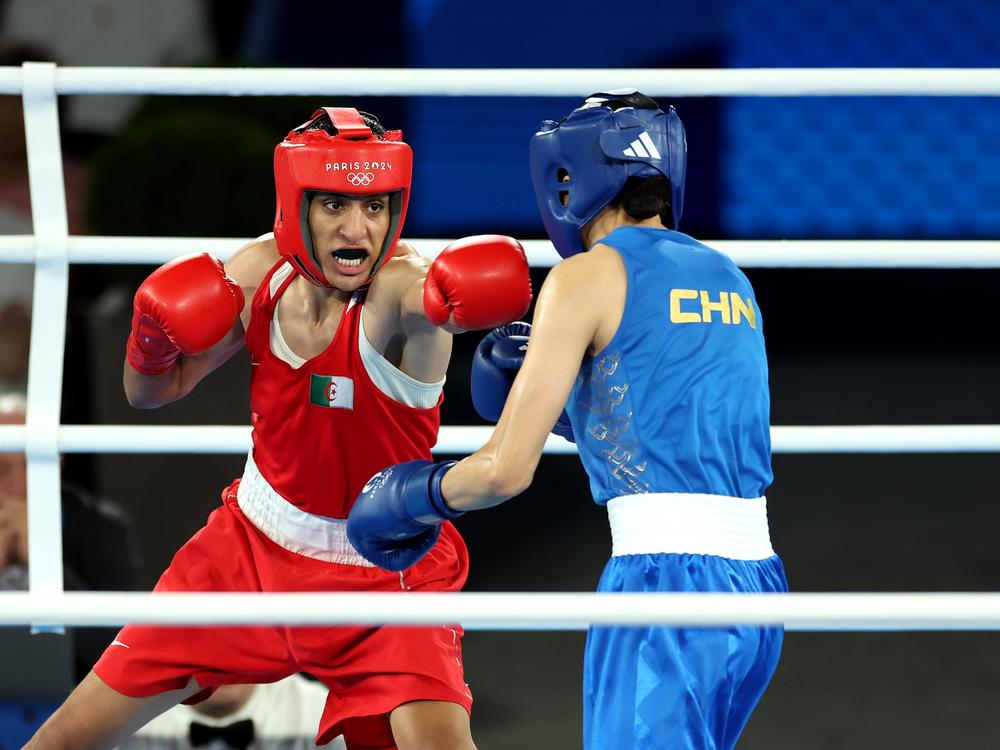 Imane Khelif of Algeria (L) defeated Liu Yang of China to win Olympic gold in the women's 66-kilogram boxing event. 