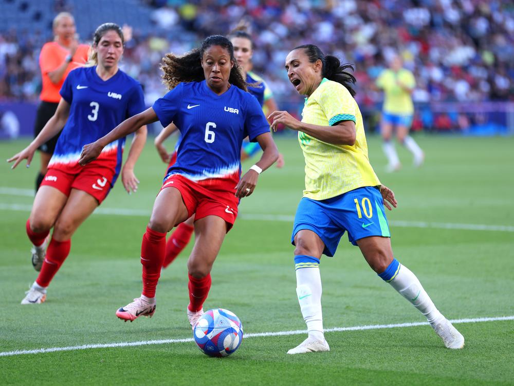 Brazilian superstar Marta (right), playing in her sixth Olympics, controls the ball against Casey Krueger of the U.S. during the women's Gold Medal match. The U.S. defeated Brazil 1-0.