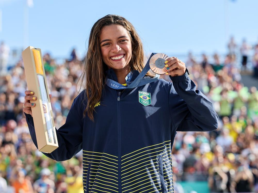 Bronze medalist Rayssa Leal attends the victory ceremony for the women's skateboarding street match at the Paris Olympics. Asked if she could tell reporters about a school subject like quadratic equations, she answered, 