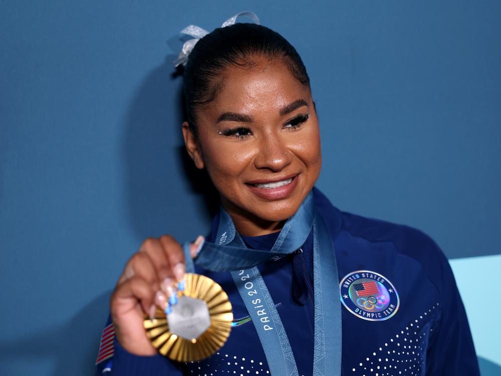 Jordan Chiles of the United States, poses with her bronze medal following the women's gymnastics floor exercise event final on Monday at the Paris Olympics. The International Olympic Committee says Chiles must return the medal following an arbitrator's decision that her initial scoring appeal came in four seconds too late.