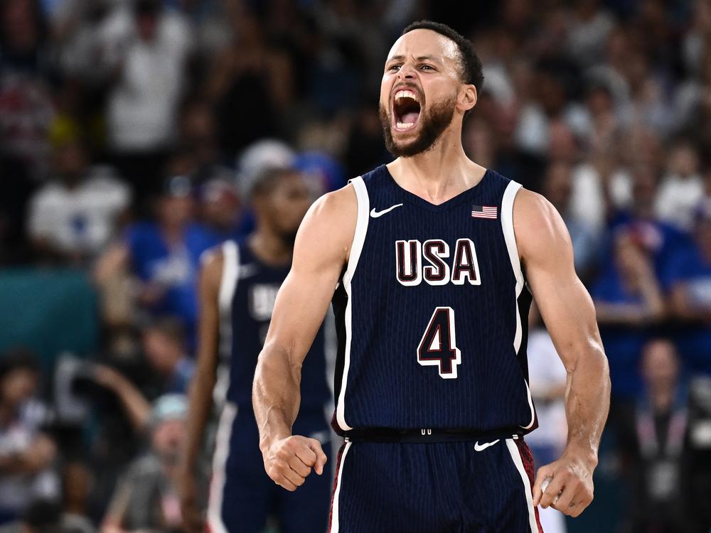 Steph Curry celebrates scoring a three-bucket during the U.S. game against France. The U.S. defeated the host country 98-87 to win its fifth-straight Olympic gold.