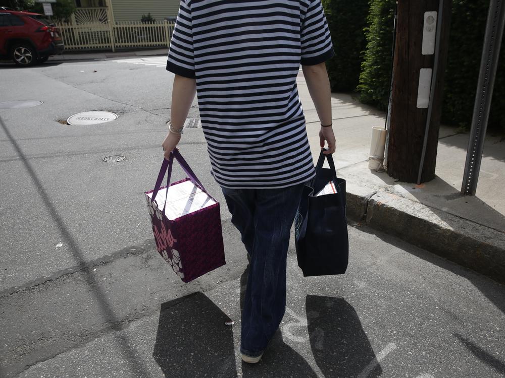 A staff member of the MAP brings the boxes containing abortion medication to the local post office.
