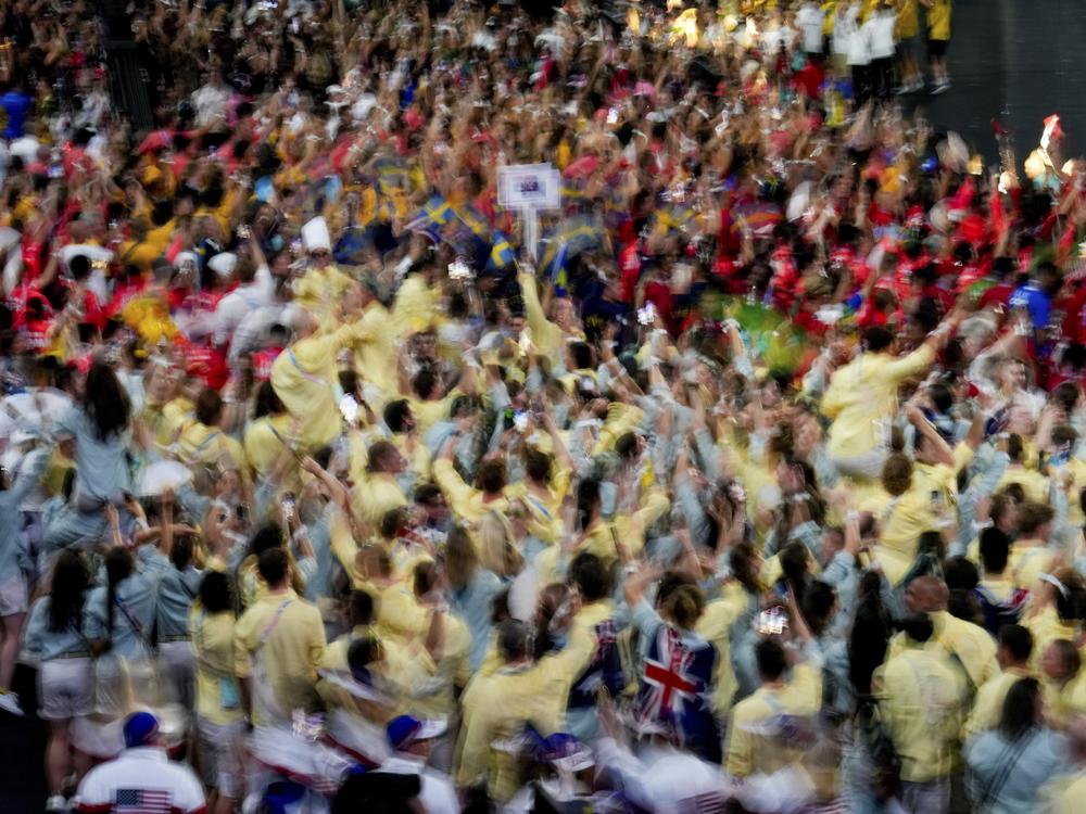 Athletes parade on Sunday.