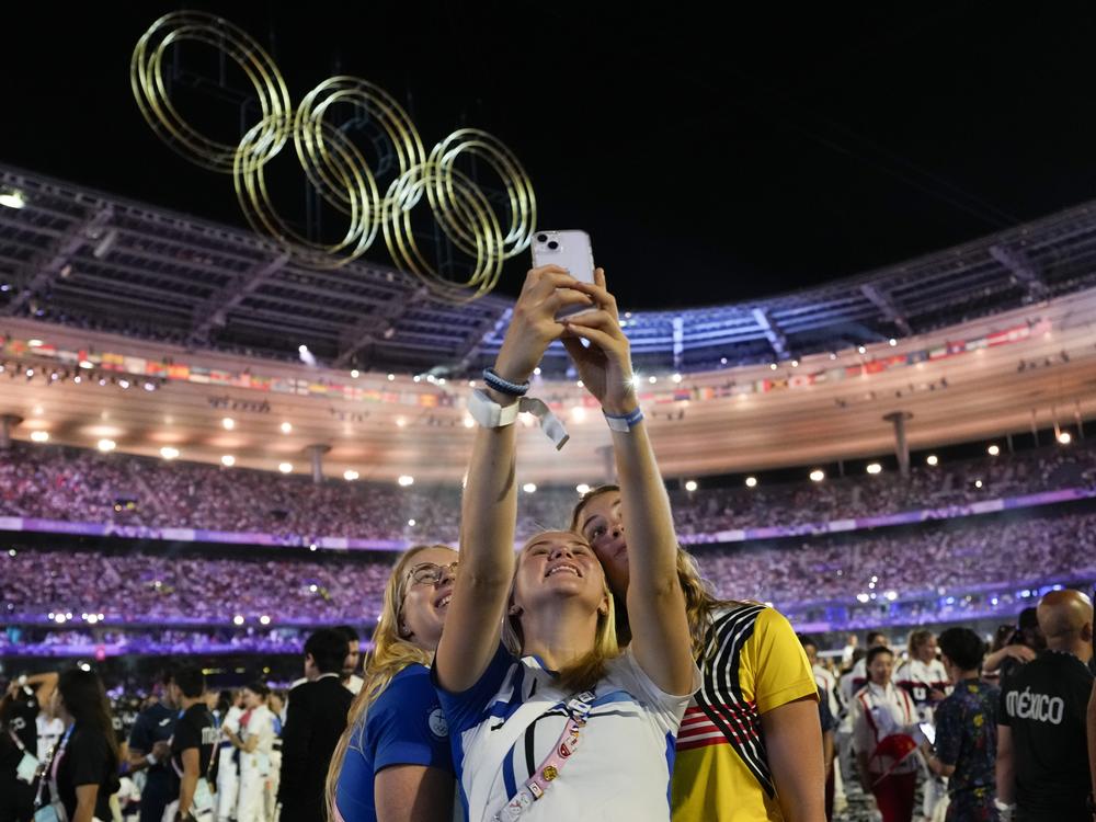 Athletes pose for a selfie on Monday.