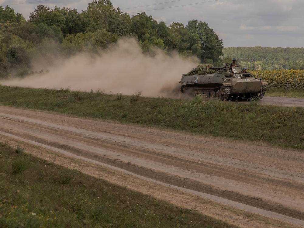 Ukrainian servicemen ride an armored fighting vehicle in the Sumy region, near Ukraine’s northeastern border with Russia on Sunday. Ukrainian troops in this area crossed into western Russia last week and have seized a large swath of territory.