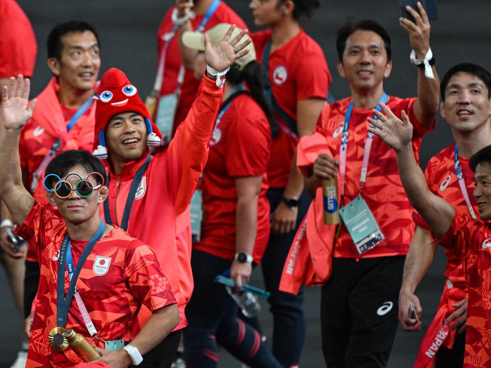 Japan's athletes take part in the athletes parade during the closing ceremony on Sunday.