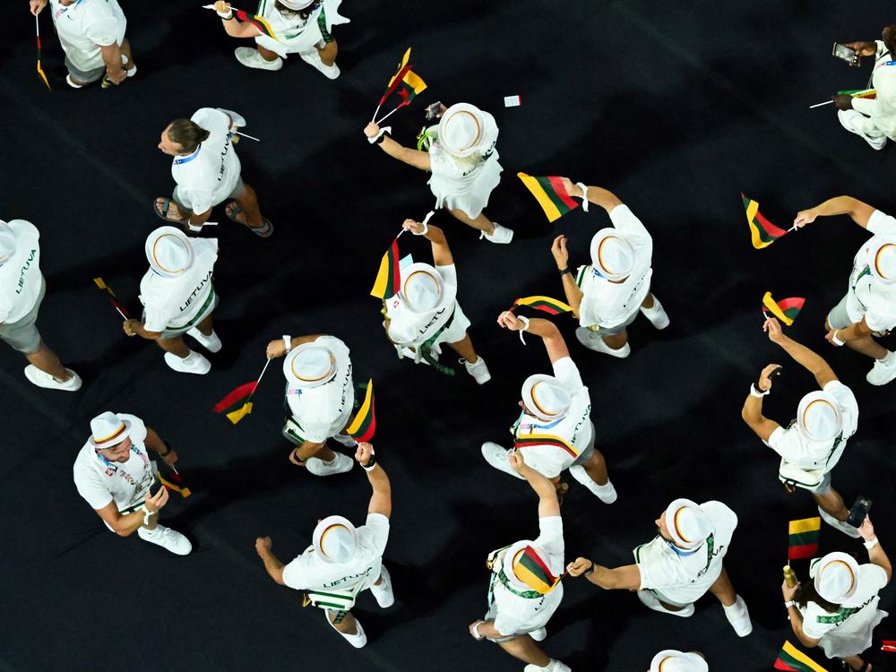 An overview shows Lithuania's athletes parading during the closing ceremony on Sunday.