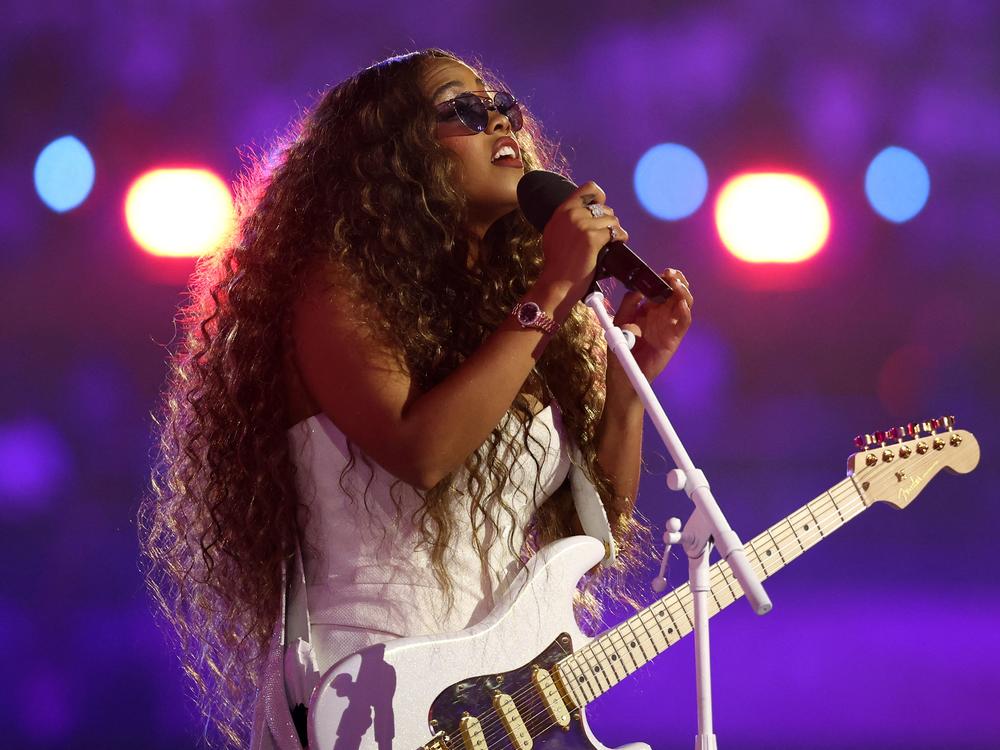 U.S. singer H.E.R. performs during the closing ceremony on Sunday.