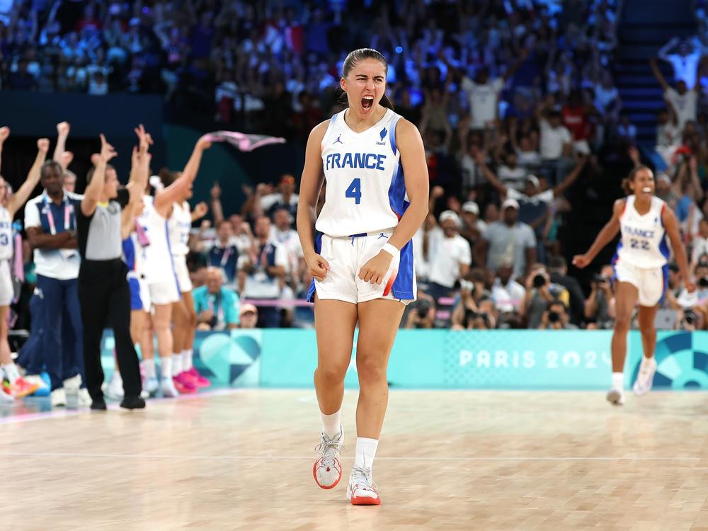 France's Marine Fauthoux reacts after a three point basket during the women's gold medal basketball game between the United States and host France.