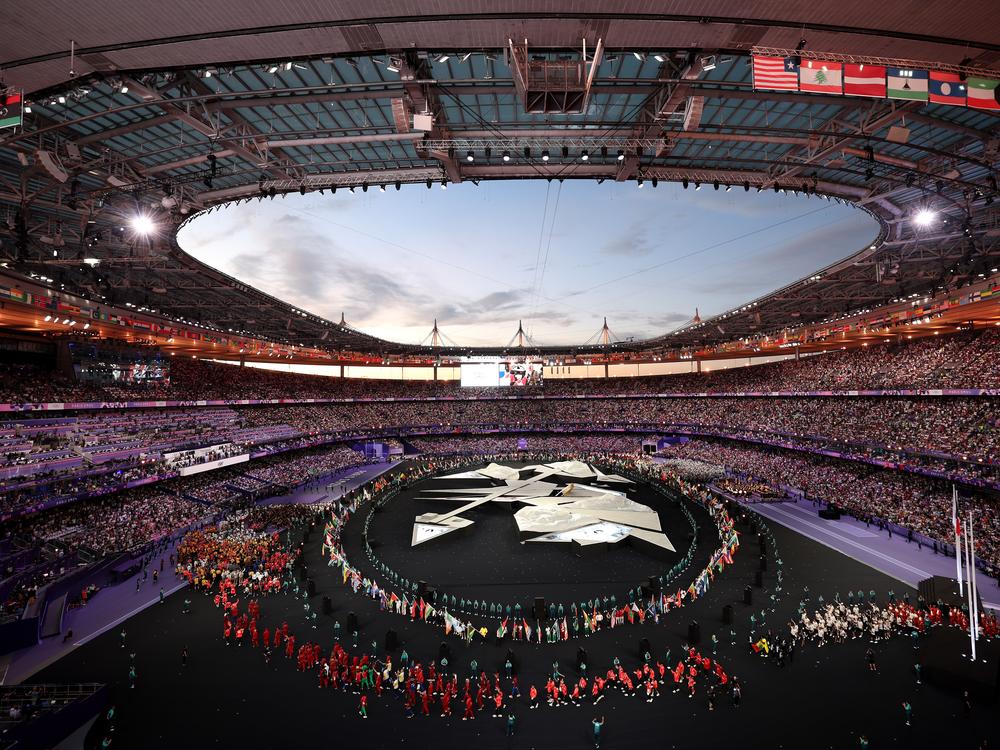The Paris Olympics closing ceremony dazzles as flag bearers and athletes stream into the Stade de France on the final day of the Summer Games.
