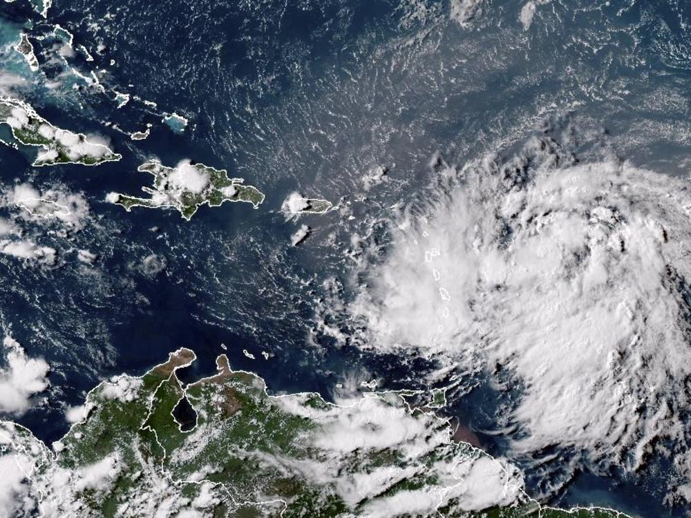 This GOES-16 GeoColor satellite image taken at 4:30 p.m. EDT Monday and provided by National Oceanic and Atmospheric Administration (NOAA) shows Tropical Storm Ernesto over the Atlantic Ocean and moving west-northwest toward the Lesser Antilles.