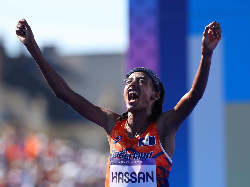 Sifan Hassan of the Netherlands celebrates after winning the women's marathon on Sunday at the Paris Olympics. She also won the bronze medal in both the 5,000- and 10,000-meter races. A remarkable Olympic running trifecta. 