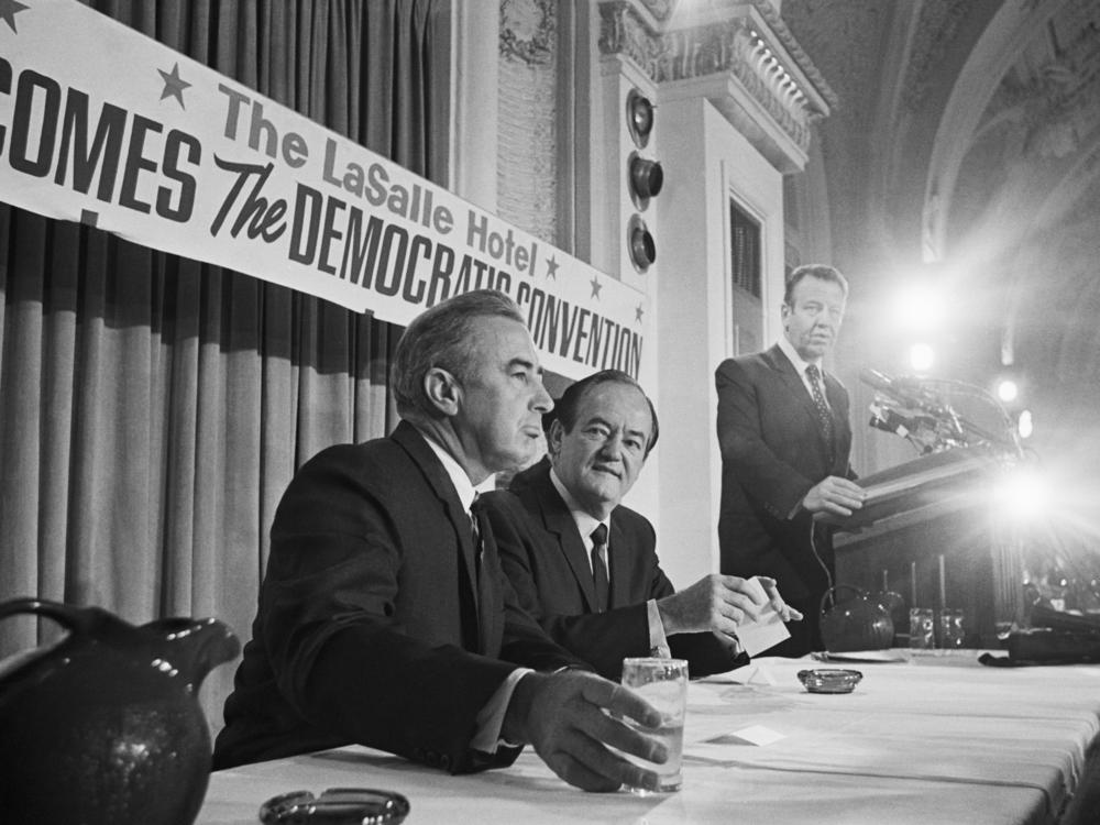 \Chicago, IL- Vice-President Hubert H. Humphrey (l) and Senator Eugene McCarthy confront each other at a meeting with the California delegation to the Democratic National Convention here August 27, 1968.