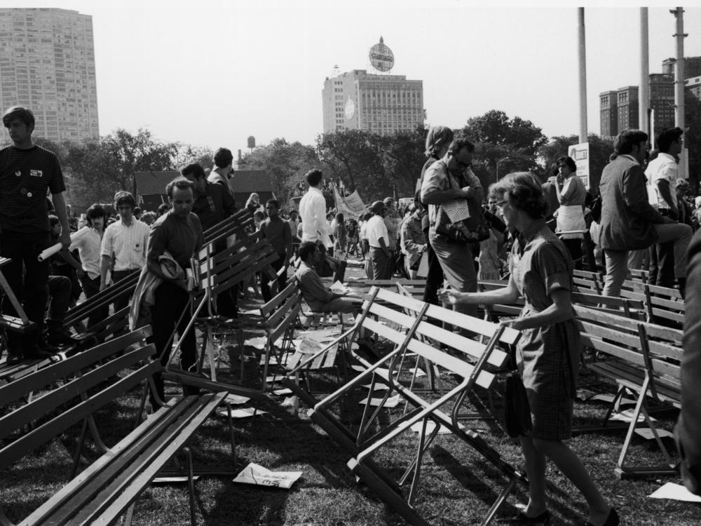 People survey the damage done to Grant Park after riots broke out during a protest of the 1968 Democratic National Convention, Chicago, Aug. 28, 1968.