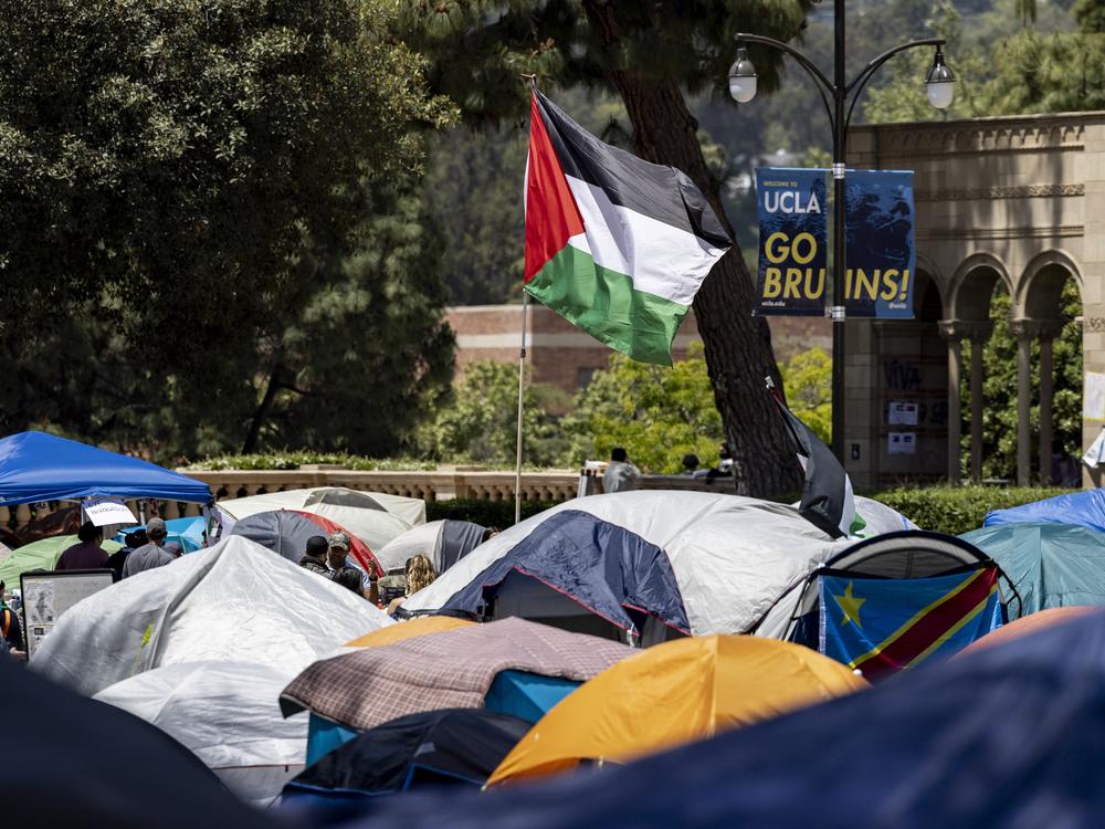 A Palestinian flag flies at a pro-Palestinian protest encampment on the campus of the University of California, Los Angeles, in May.