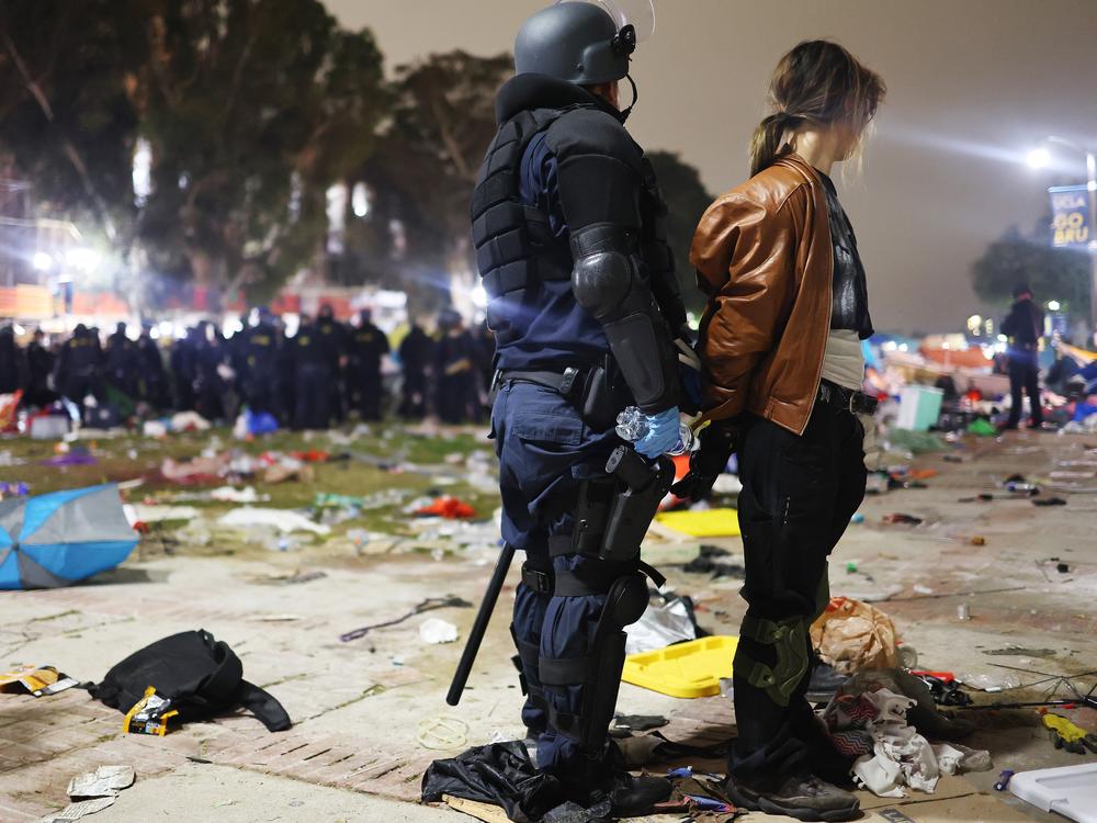 A California Highway Patrol officer detains a protestor in May while clearing a pro-Palestinian encampment at the University of California, Los Angeles, after university officials declared the camp unlawful.